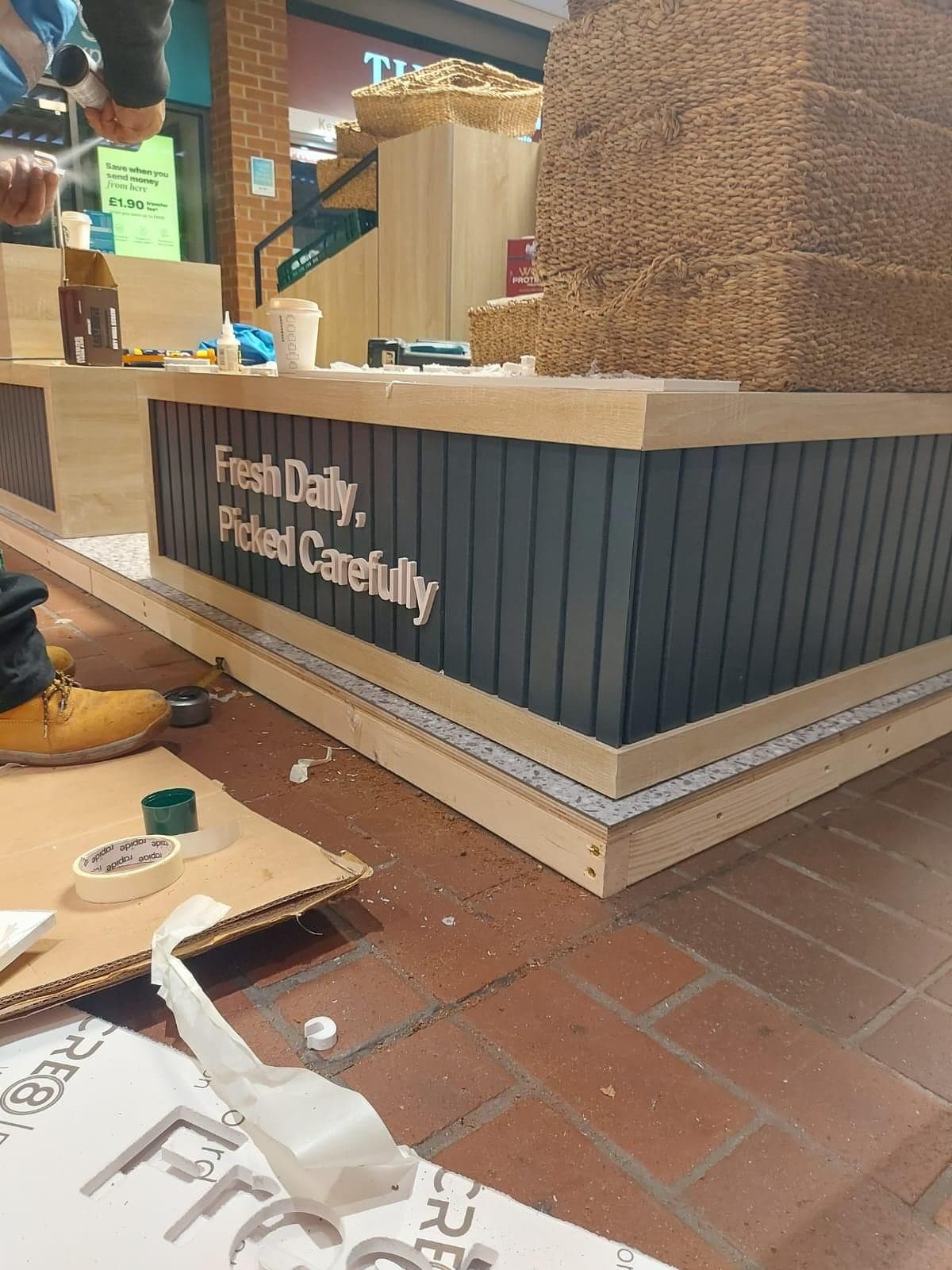 Dark panelled fascia with the 'Fresh Daily, Picked Carefully' lettering fitted to the Freshpoint unit