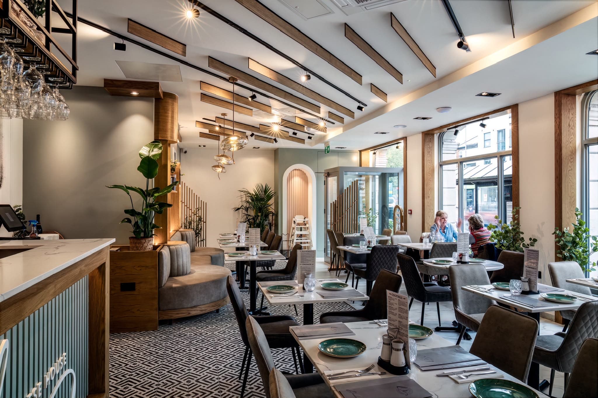 Lebanese House dining room seen from the bar, looking towards the arched alcoves and street windows