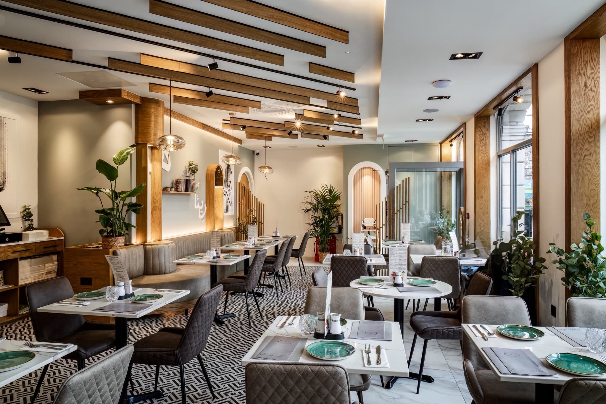 Lebanese House restaurant dining room with oak ceiling battens, arched alcoves and a banquette along the wall